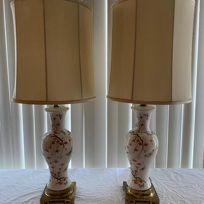 Pair of vintage floral ceramic lamps with brass finish bases