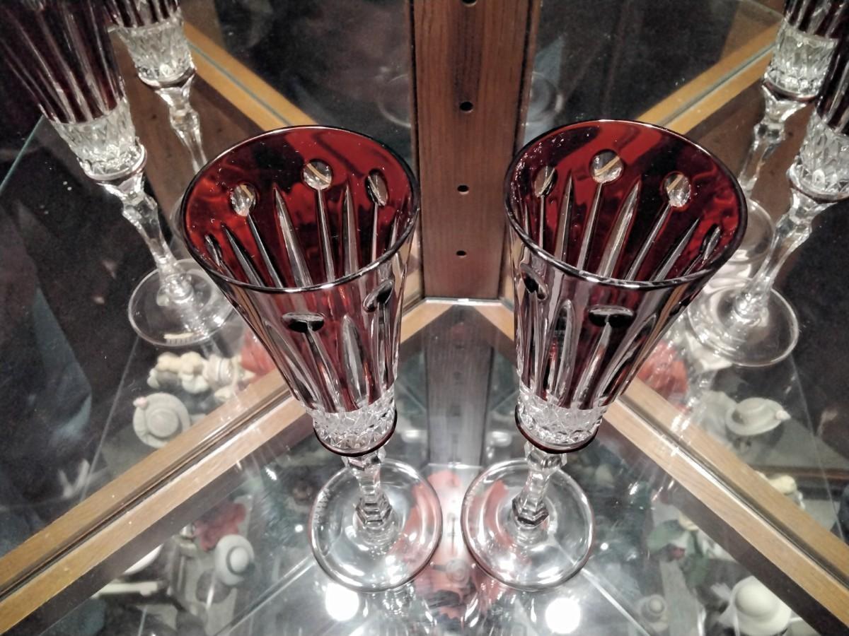 FABERGE Set of 2 XENIA Ruby Red Cut to Clear Crystal Champagne Flutes  signed In presentation case | EstateSales.org