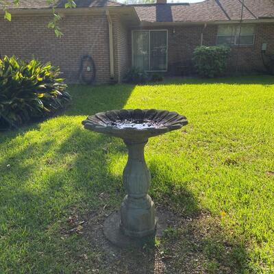 Cement birdbath, sunflower shaped