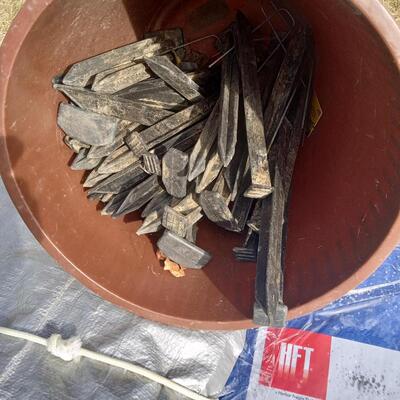 LOT 108  FOUR TARPS, GROMMET KITS, STAKES AND D RING ANCHORS