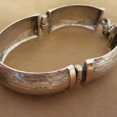 Split Cuff Sterling Bracelet with gold trim.