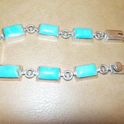 Turquoise Sterling silver bracelet with push lock.