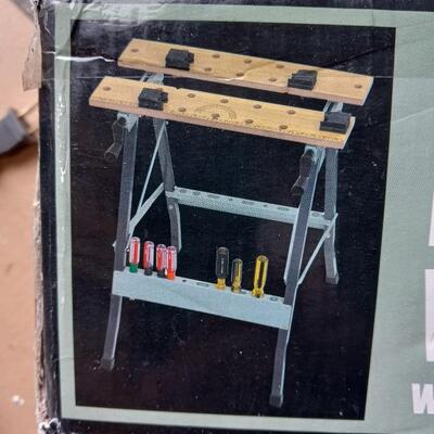 LOT 39  NEW FOLDING CLAMPING WORKBENCH WITH MOVABLE PEGS