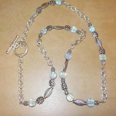 22 in. Sterling silver loop and bead necklace.