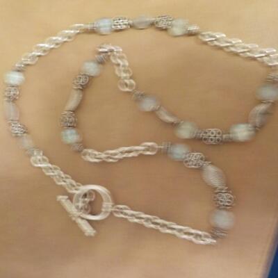 22 in. Sterling silver loop and bead necklace.