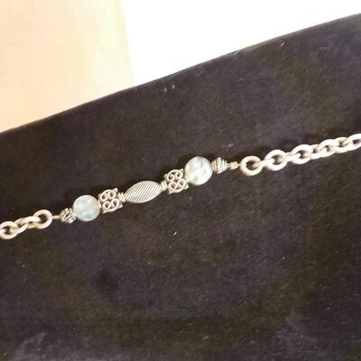22 in. Sterling silver loop and bead necklace.