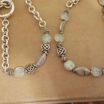 22 in. Sterling silver loop and bead necklace.