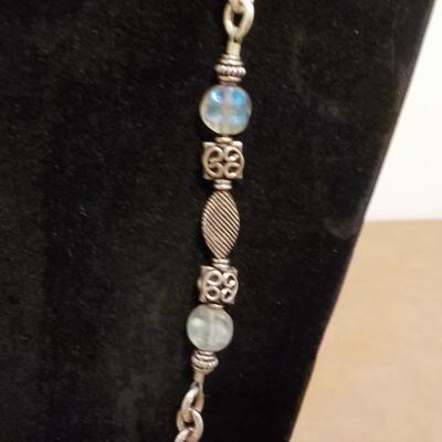 22 in. Sterling silver loop and bead necklace.