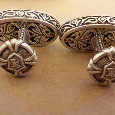 Sterling silver hand crafted cuff links.