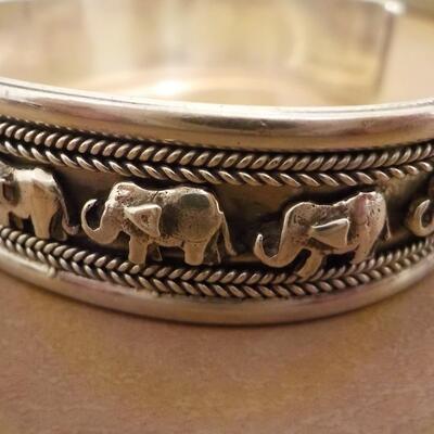 Sterling silver curb engraved elephant bangle.
