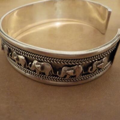 Sterling silver curb engraved elephant bangle.