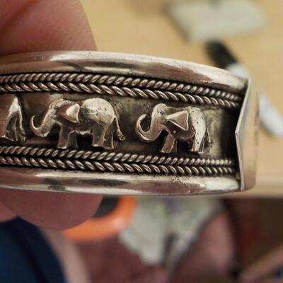 Sterling silver curb engraved elephant bangle.