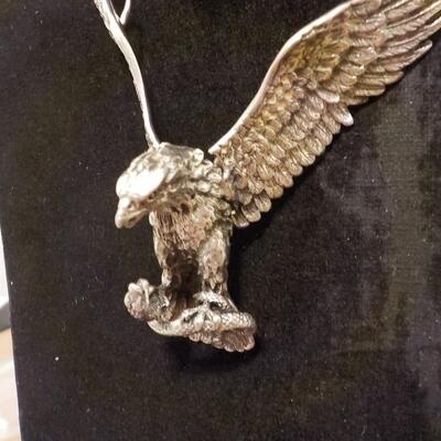 Sterling silver Eagle attacking a snake/ wings move. Necklace.