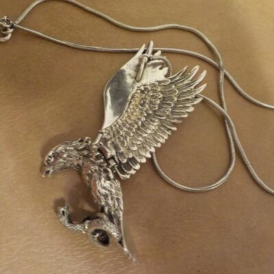 Sterling silver Eagle attacking a snake/ wings move. Necklace.