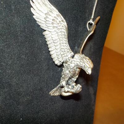 Sterling silver Eagle attacking a snake/ wings move. Necklace.