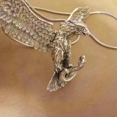 Sterling silver Eagle attacking a snake/ wings move. Necklace.