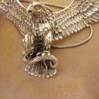 Sterling silver Eagle attacking a snake/ wings move. Necklace.