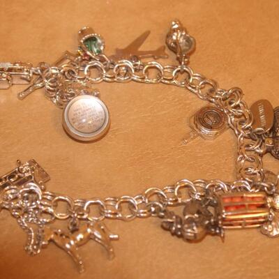 Charm bracelet a mixture of sterling and nickel silver.