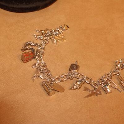 Charm bracelet a mixture of sterling and nickel silver.