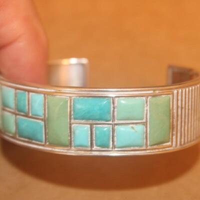 Sterling silver Bracelet curb with green stone inlay.