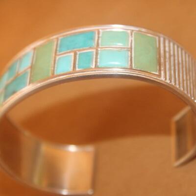 Sterling silver Bracelet curb with green stone inlay.