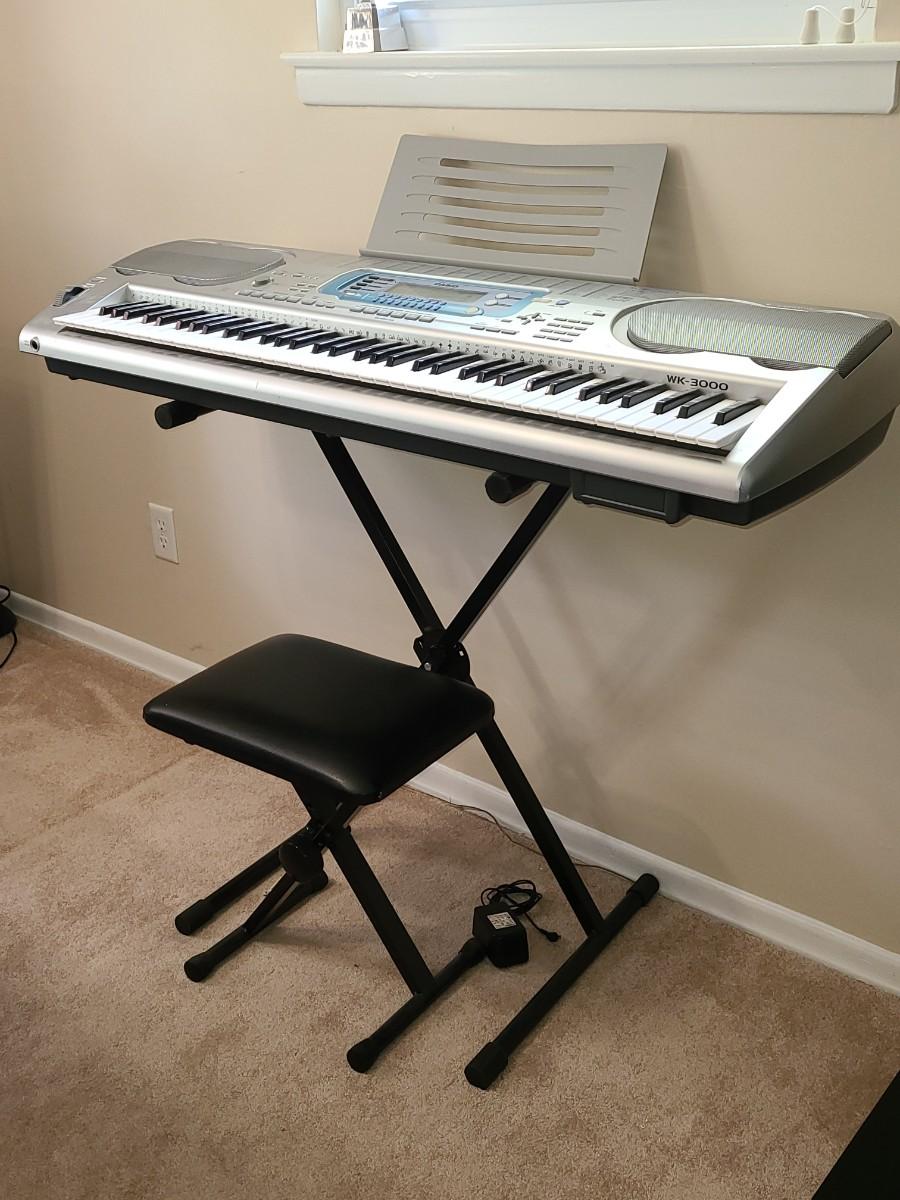 Lot 304: Casio WK-3000 76 Key Digital Recording Studio Styled Keyboard  w/Stand & Chair | EstateSales.org