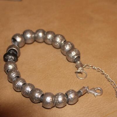 Sterling silver flex bracelet.