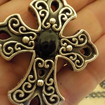Sterling silver cross euro design with black onyx stone.
