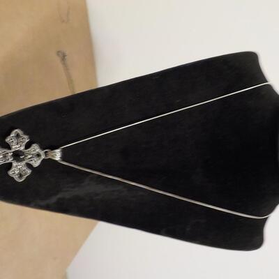 Sterling silver cross euro design with black onyx stone.