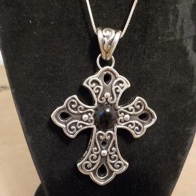 Sterling silver cross euro design with black onyx stone.