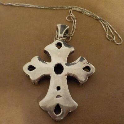 Sterling silver cross euro design with black onyx stone.
