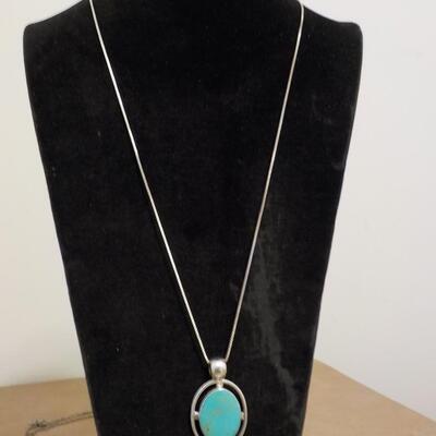 Sterling silver turquoise raised stone.