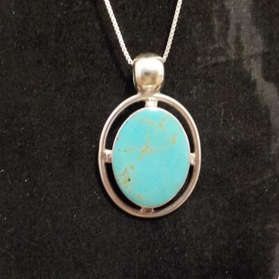 Sterling silver turquoise raised stone.