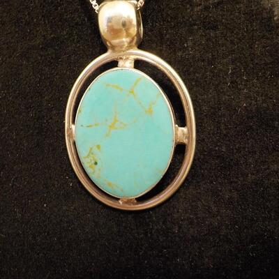Sterling silver turquoise raised stone.