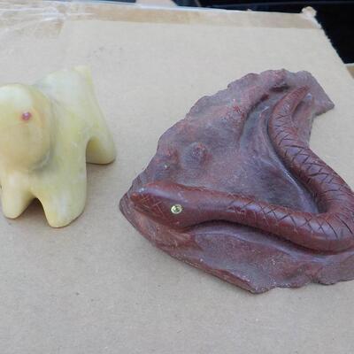 Hand crafted polar bear (jade) and snake (red stone).