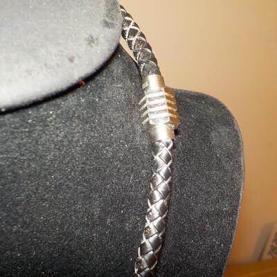 Sterling silver Celtic design with leather wrap chain.