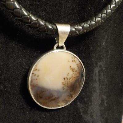 Sterling silver Celtic design with leather wrap chain.