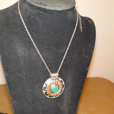 Art-Deco Sterling silver with jade and tigers eye stones.