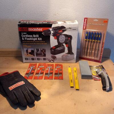 LOT 122  DRILL MASTER CORDLESS DRILL, NEEDLE FILE SET, DRILL BITS, WORK GLOVES AND BOX CUTTER