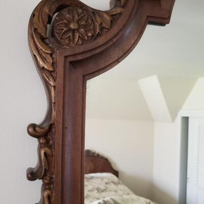 Antique shield-shaped mirror, wood frame