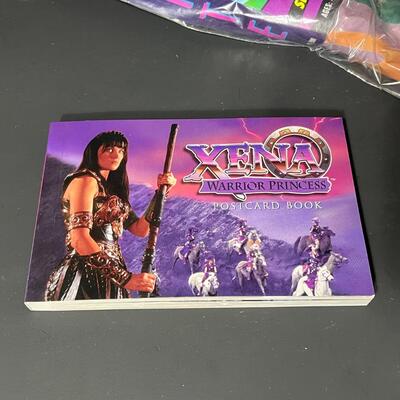 LOT 75: Big Lot of Xena Memorabilia - DVDs, VHS, Jewelry, Posters & More