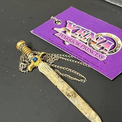 LOT 75: Big Lot of Xena Memorabilia - DVDs, VHS, Jewelry, Posters & More