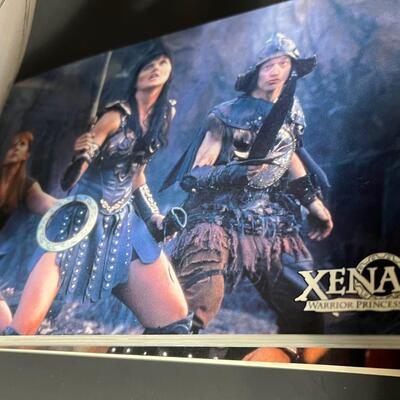 LOT 75: Big Lot of Xena Memorabilia - DVDs, VHS, Jewelry, Posters & More