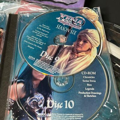LOT 75: Big Lot of Xena Memorabilia - DVDs, VHS, Jewelry, Posters & More