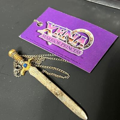 LOT 75: Big Lot of Xena Memorabilia - DVDs, VHS, Jewelry, Posters & More