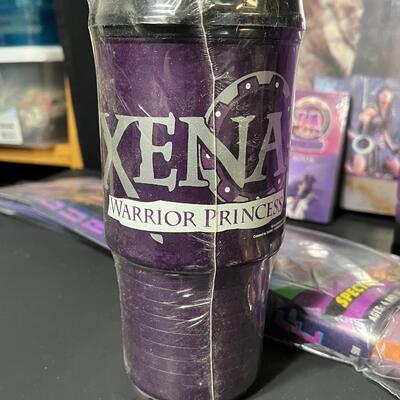 LOT 75: Big Lot of Xena Memorabilia - DVDs, VHS, Jewelry, Posters & More