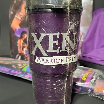 LOT 75: Big Lot of Xena Memorabilia - DVDs, VHS, Jewelry, Posters & More