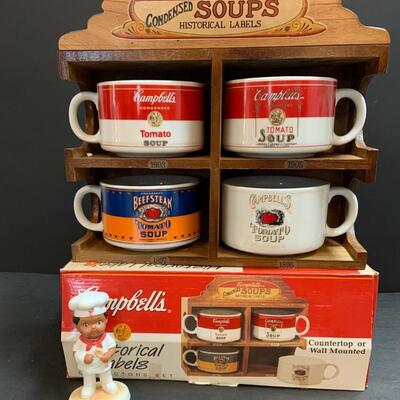 LOT:140: Lot of Campbellâ€™s Soup 4 Mugs with shelf and figure.