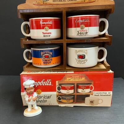 LOT:140: Lot of Campbellâ€™s Soup 4 Mugs with shelf and figure.
