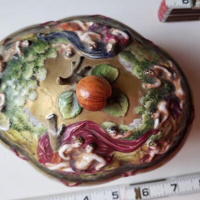 Small Capodimonte bowl with Lid, carvings of figures and babies